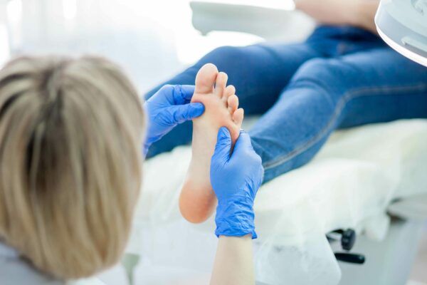 podiatry-doctor-treating-feet-nails